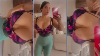 Ashley Carolina Rabuda con teléfono celular grabando sus senos